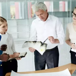 Private Detective and the team looking at the evidence gathered for a job.